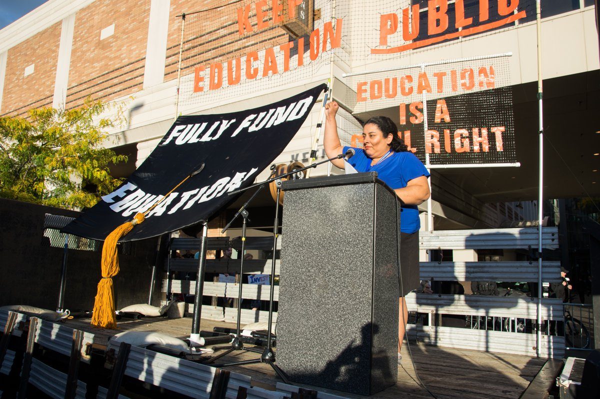 A rally of protestors against Betsy DeVos is shown