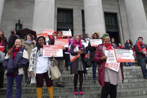 YWCA advocates stand on the Legislative building steps.