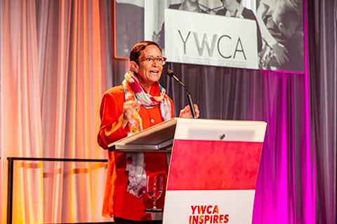 YWCA CEO Maria Chavez Wilcox on stage at 2018 Seattle Luncheon