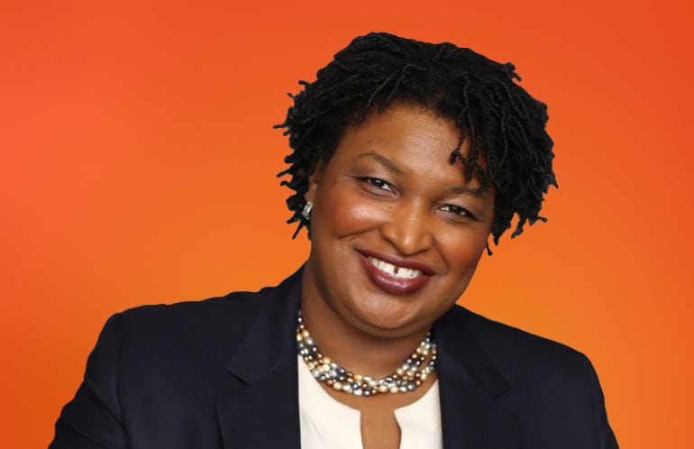 Stacey Abrams on a persimmon background