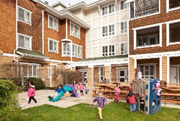 Children play at an affordable housing playground