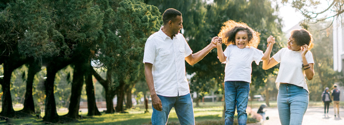 A family walking through a park.