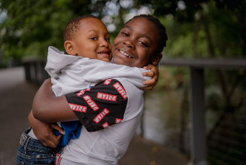 Two brothers hug each other