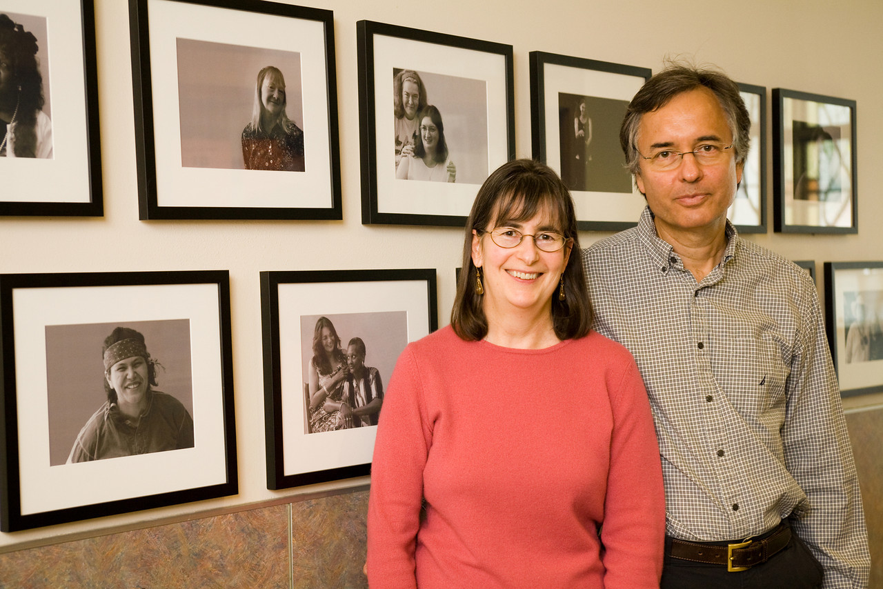 Couple standing in front of YWCA photos