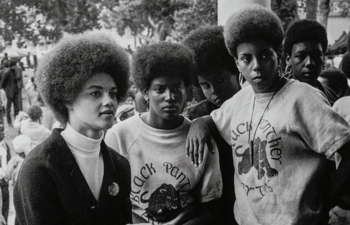 Kathleen Cleaver (left) communications secretary and the first female member of the party's central committee, with Black Panthers from LA at the Free Huey rally in West Oakland. July 28, 1968. Photograph: Stephen Shames.
