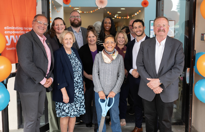 Event speakers standing together after the ribbon cutting ceremony.