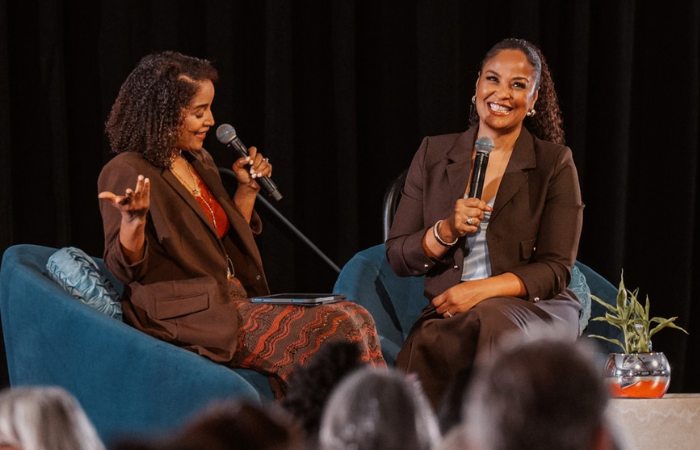 Photo of Angela Poe Russell and Laila Ali together on stage at the 2026 Inspire Luncheon