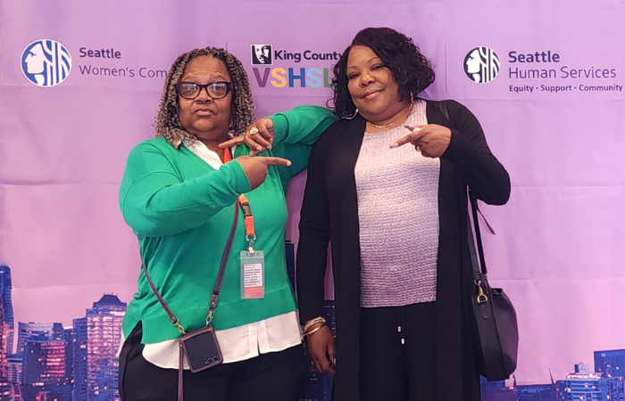A photo of Nature Carter and Doris O'Neal in front of a purple background