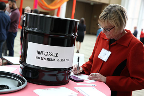 Luncheon attendee at time capsule station