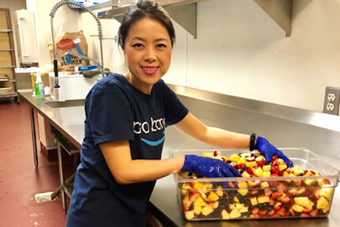 Photo of volunteer serving meals