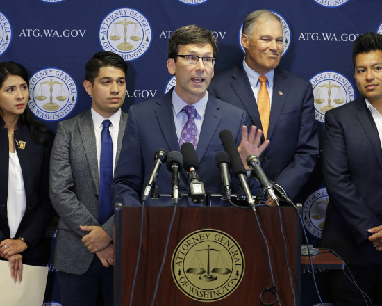 Bob Ferguson is pictured with Governor Jay Inslee and Dreamer advocates