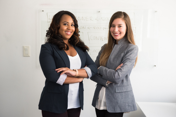 Picture of Black woman and white woman in professional attire