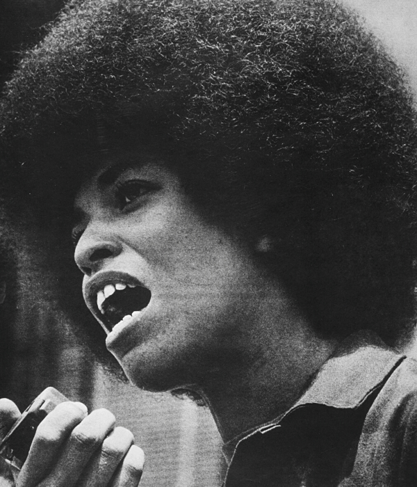 Black and white photo of Angela Davis holding a megaphone