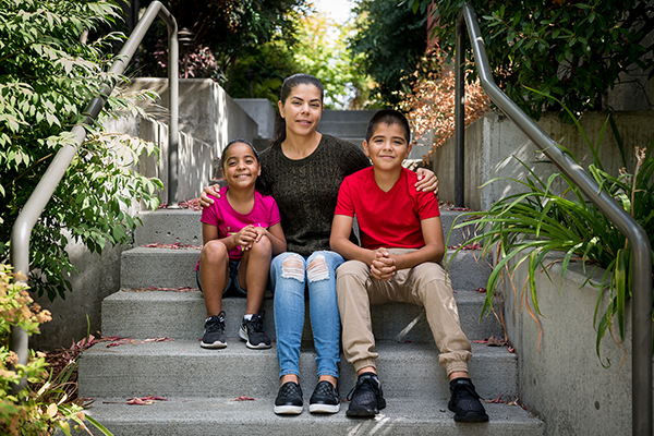 A woman and her children are pictured