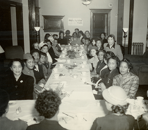 1950's photo of YWCA members sharing dinner