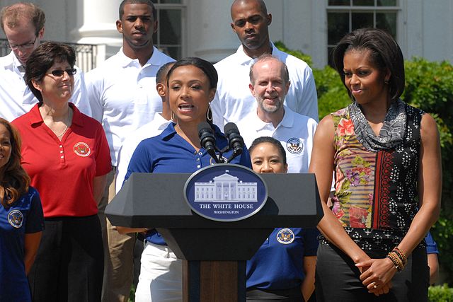 Dominique Dawes with First Lady Michelle Obama during a fitness and nutrition event as part of the President's Council on Fitness, Sports and Nutrition
