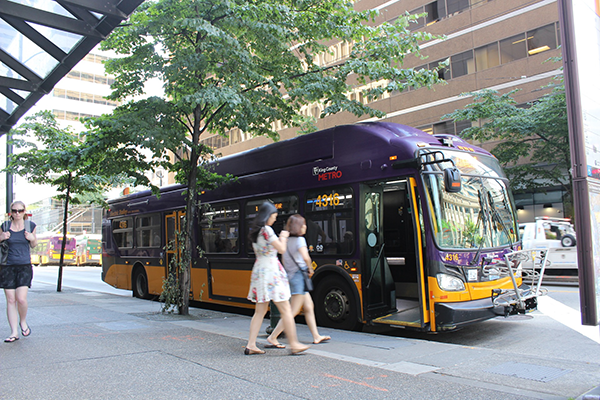 Two women board a bus