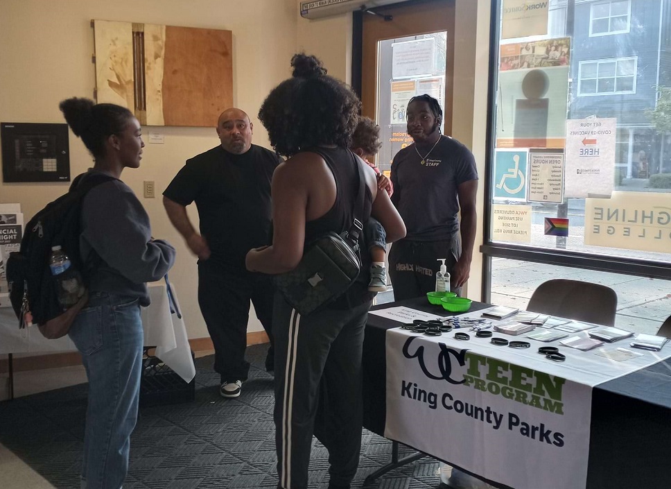 Namos from SW Boys and Girls Club and Rasheed with KC Parks and Rec talking with youth about teen programs