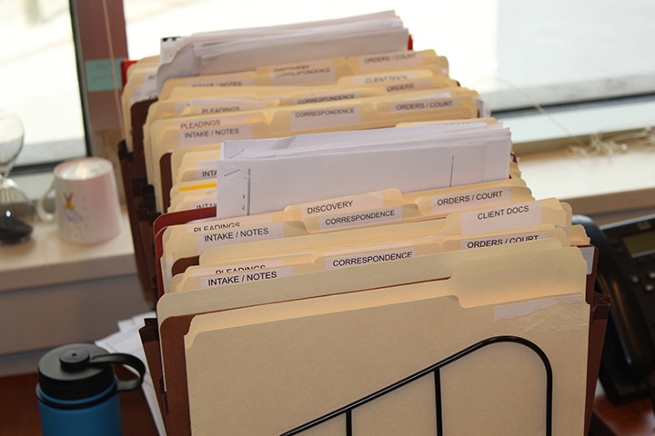 Folders of files on a desk.