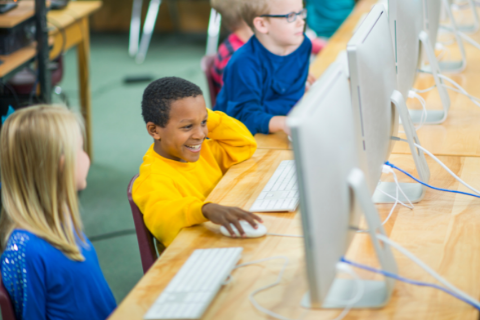 Picture of African American boy using a computer lab