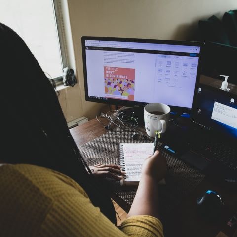 Photo of woman looking at website