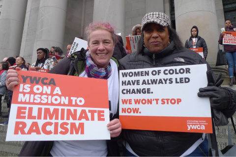 Picture of staff members at Olympia during an advocacy day with YWCA signs
