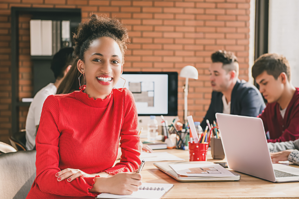 Picture of woman at work desk smiling