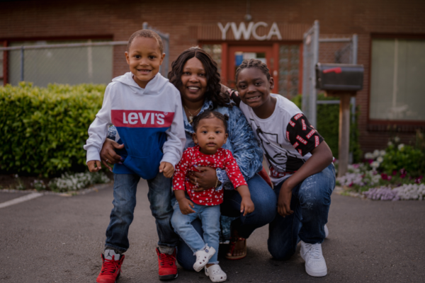 Picture of African American family posing in front of YWCA
