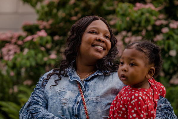 Photo of a Black woman and baby.
