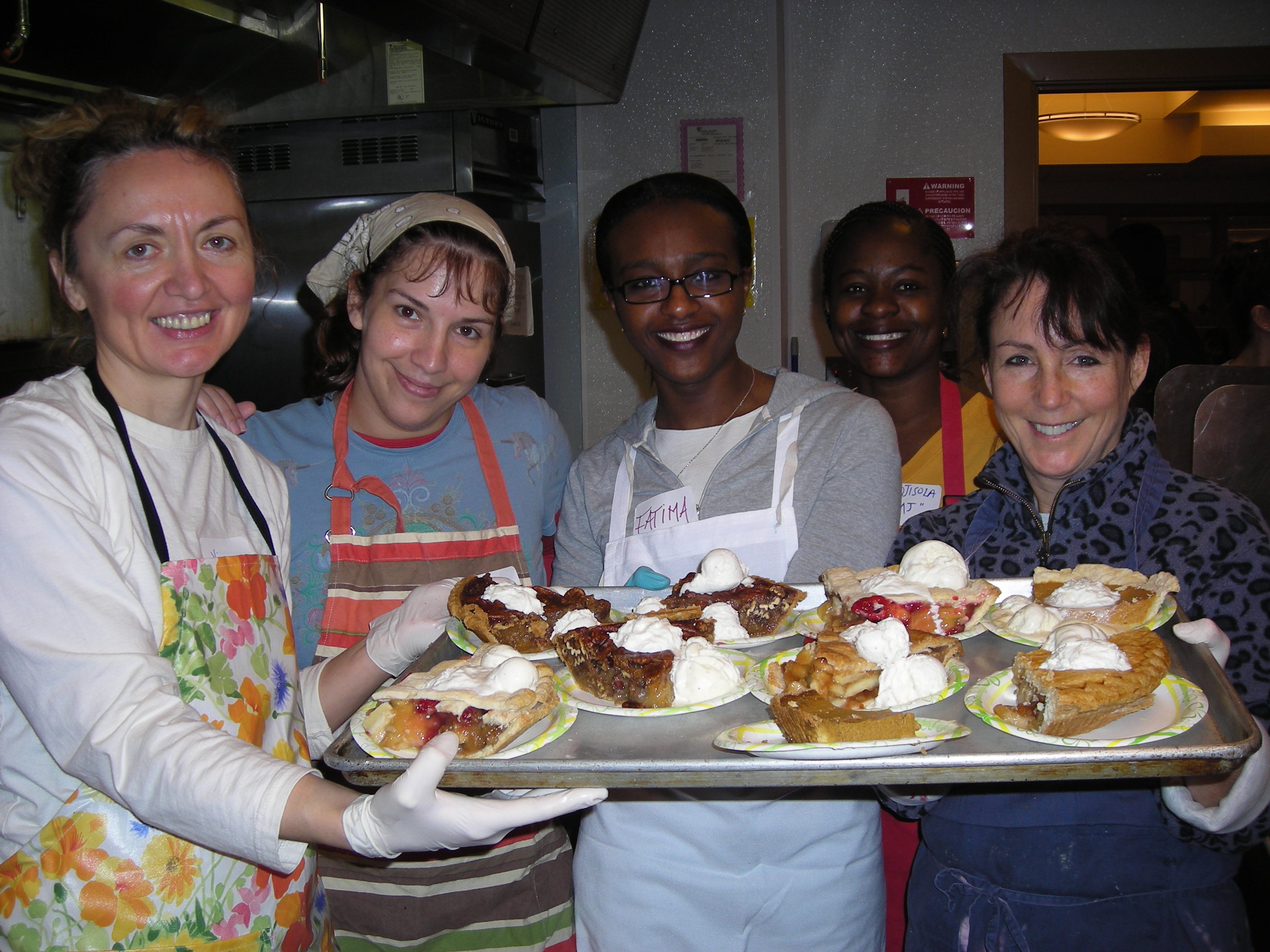 Volunteers helping serve lunch at YWCA's Angeline's Day Shelter