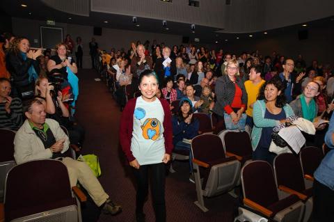 Inocente walks down the aisle at Seattle Art Museum