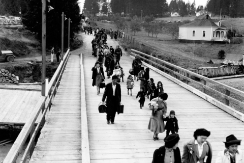 Japanese Americans leaving Bainbridge Island after being forced to relocate to internment camps during WWII