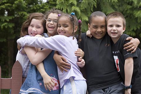 Family of five hugging