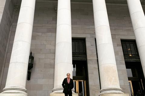 Maya Manus stands in front of the Washington State Legislative Building