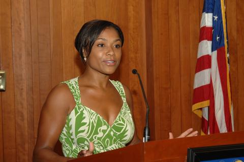 Dominique Dawes gives a speech during a visit to the offices of the U.S. Department of Housing and Urban Development