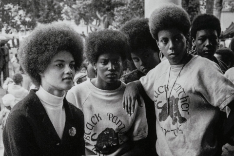 Oakland, California: Kathleen Cleaver, Communications Secretary and first female member of the Party’s decision-making Central Committee, talks with Black Panthers from Los Angeles who came to the “Free Huey” rally in DeFremery Park (named by the Panthers Bobby Hutton Park) in West Oakland, July 28, 1968. Stephen Shames (American, born in 1947) Photograph, archival pigment print, * Gift of Lizbeth and George Krupp * © 2023, Stephen Shames * Courtesy Museum of Fine Arts, Boston
