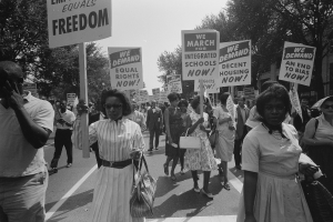 Black and white photo of a 1960s school integration march